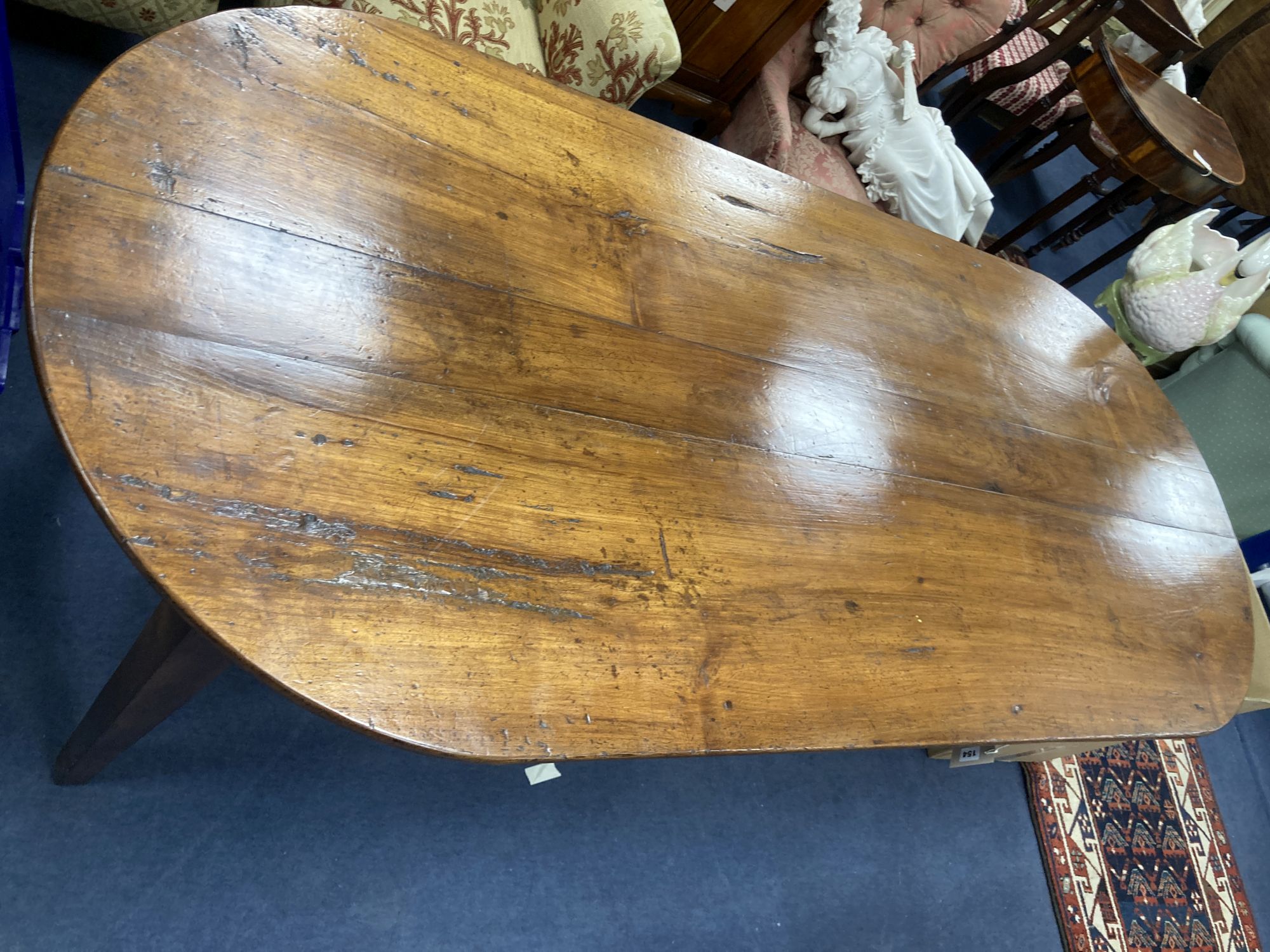 A 19th century fruitwood provincial dining table on square tapered legs, length 210cm, depth 90cm, height 77cm